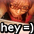 Pixelated image of a character with brown hair and red clothing, overlaid with bold text reading 'hey =)'.