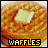 Pixelated waffle with butter and syrup, labeled 'WAFFLES' in yellow text on black background.