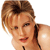 Pixelated close-up of a person with light brown hair styled in a voluminous updo, wearing a dark strap over one shoulder against a plain white background.
