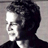 Pixelated grayscale portrait of a person in profile view with dark hair and light skin, displayed as a static buddy icon on a gray background.
