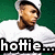 Pixelated image of a person with brown hair and beard wearing white shirt against green background, with text 'hottie' below.