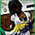 Animated icon of a person with dark hair in a white shirt and yellow-blue scarf, leaning forward with a hand near their face, against a light background with dark rectangular shapes.
