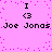 Pixelated pink background with scattered purple dots, black text "I <3 Joe Jonas" repeated in two