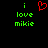 Green pixelated text 'i love mikie' on black background with red heart symbol above 'i' on left side.