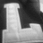 Black-and-white image of large stylized letters L, B, S, U with yellow pixelated text overlays reading "FLIGHT" and "CHOCO".