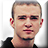 Static 48x48 pixel icon showing a close-up of a person's head and shoulders with short hair, visible ears, and dark clothing against a light background.