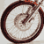 A 7-frame animated contact sheet showing a motorcycle in motion with sepia-toned color scheme and visible wheel rotation, engine details, and body movement across frames.