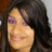 A person with long dark hair and purple eyeshadow smiles in a static image, showing subtle variations across three views.