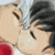 Two anime-style characters with closed eyes kiss, one with silver hair and the other with dark blue hair and cat ears.