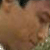A pixelated animated image shows two people in close proximity, with one person's face partially visible on the left and another person's face on the right, both with blurred features.
