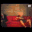 Animated contact sheet showing a person on a red couch with changing poses and repeated text "Go on... take everything" in purple script.