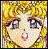 Pixelated close-up of a face with light skin, dark eyes, and blonde hair against a yellow background.
