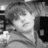 Black-and-white pixelated image with text overlay: a person with light hair in a dimly lit indoor setting, text reads 'anyone can catch your eye but... it takes someone special to catch your HEART<333'