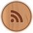 Circular wooden-textured icon with brown RSS symbol centered on light brown background.