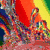 Four distinct pixelated images arranged in a : top-left shows a colorful abstract shape, top-right displays piano keys with rainbow colors, bottom-left features a flower-like icon with multicolored petals, bottom-right is a solid gray square