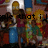 Pixelated image of multiple figures in colorful clothing with partial text overlay reading 'e that i' in black block letters.