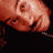 Animated contact sheet of a person's face in multiple poses with text banners reading THE RED LIGHT DISTRICT, IN STORES NOW, and LUDACRIS.NET on red backgrounds.