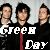 Animated contact sheet of Green Day band members with changing text colors across 9 frames showing 'Green' and 'Day' in white/red on black backgrounds.