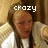 Pixelated image of a person with long dark hair wearing a white top, with the word 'crazy' in white block letters overlaid on the upper portion.
