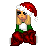 Pixelated image of a blonde woman in Santa hat, green top, red pants, hands clasped near face, on white background with red/green text blocks.