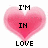 Pixelated pink heart-shaped icon with black text reading "I'M IN LOVE SOCCER PLAYER!" and a smaller heart containing "WITH A".