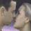 Two figures in a close embrace, one with short dark hair and the other with long light-colored hair, against a gradient background shifting from purple to blue.