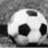 Two soccer balls with black and white , green text reading "Hulmeville Soccer" on the right ball