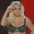 Pixelated image of a person with blonde hair wearing a dark bra, hand raised to forehead against red background; text "It's Britney Bitch" in red pixel font.