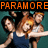 Pixelated image of five people with orange text 'PARAMORE' at top left and '<3' at bottom right on teal background.
