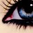 Pixelated close-up of a character's face with dark hair, blue eyes, and red lips against a light background.