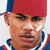 Two side-by-side pixelated portraits of men with distinct facial features and clothing, one wearing a red cap and striped shirt against white background, the other in sunglasses and blue backdrop.