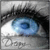 A close-up of a human eye with blue iris and black eyelashes, next to handwritten text reading 'Blue Eyed Angel' in blue pixelated font.