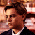 A pixelated image of a person with brown hair in formal attire, next to green text reading 'Original Icons .com' on a dark background.