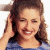 A pixelated image of a person with brown hair wearing a blue striped shirt, positioned next to green text on a dark background.