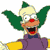 Pixelated cartoon character with green hair, red nose, purple suit, and yellow sleeves in a static single-frame image.
