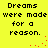 Yellow background with black pixelated text reading 'Dreams were made for a reason.' and red pixelated dots forming a curved line.