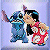 Two pixelated figures embrace; one wears blue clothing with a raised arm, the other wears red and white clothing with a black collar.