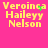Yellow text reading "Veroince Haileyy Nelson" on a bright pink background with green pixel clusters appearing and disappearing in the top-right and center-left of the text.