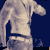 Four of a pixelated figure in motion against a solid dark blue background, showing a character with a light-colored shirt and dark belt