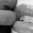 A 4x5 contact sheet of grayscale animated frames showing a close-up of lips with the word 'kiss' in pixelated text, arranged left-to-right and top-to-bottom.