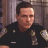 A split-frame contact sheet showing a pixelated police officer on the left and green text reading "Original Icons .com" on the right against a dark background.