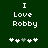 Green background with white pixelated text "I Love Robby" and five heart symbols below, where the third heart changes from gray to white between frames.