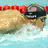 A swimmer in a pool with goggles, water splashes, and red lane dividers; another view shows the swimmer adjusting goggles while wearing an orange medal.