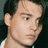Pixelated image of a person with dark hair and light skin, next to text reading 'Property of Crystal' on a black background.