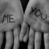 Two hands with 'ME' and 'YOU' written on palms, fingers slightly curled, black-and-white grayscale image.