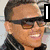 A four- shows a person in various poses: sunglasses and dark jacket, cap with heart symbol, red baseball cap, and black sleeveless top with CB text