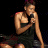 A pixelated contact sheet showing two frames of an animated icon featuring a woman singing into a microphone on the left and green text reading "Original Icons .com" on the right against a dark background.