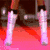 A person in a bright pink dress with long brown hair, shown from multiple angles including legs and upper body.