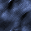 Four distinct fabric textures in blue, green, red, and gray arranged in a pattern with visible weave details