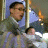 A 48x48 pixel animated contact sheet showing two frames of a buddy icon with a person in motion on the left and green text logo on the right against dark background.